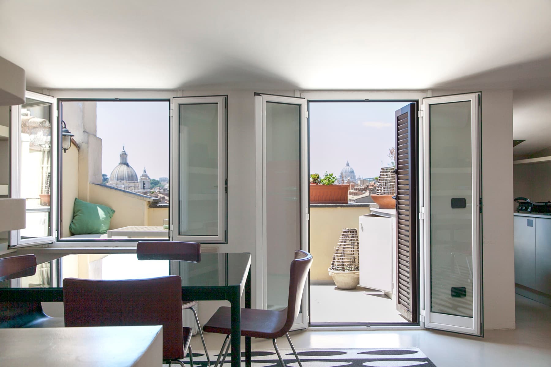 The attic living room opening onto two terraces, domes on the horizon